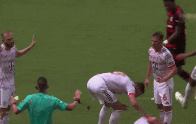 A Soccer Player With The Number 6 On His Jersey Is Laying On The Ground GIF