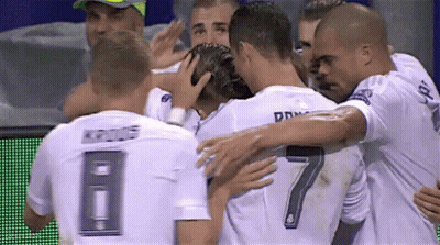 A Soccer Player With The Number 7 On His Back Is Hugged By His Teammates GIF