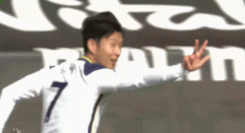 A Soccer Player With The Number 7 On His Jersey Is Giving The Peace Sign GIF