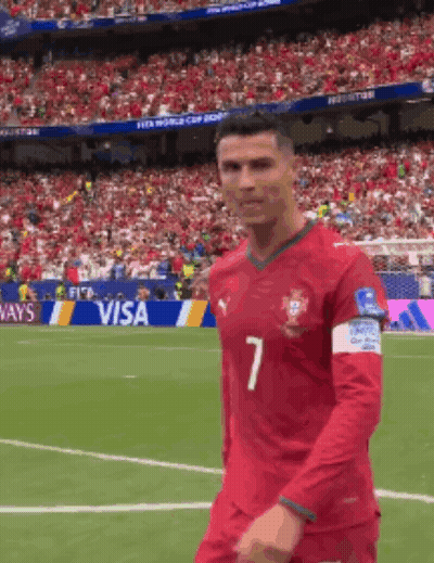A Soccer Player With The Number 7 On His Jersey Is Walking On The Field GIF