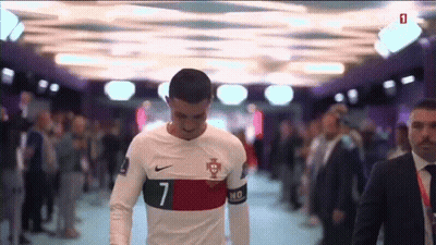 A Soccer Player With The Number 7 On His Jersey Walks Through A Crowd GIF