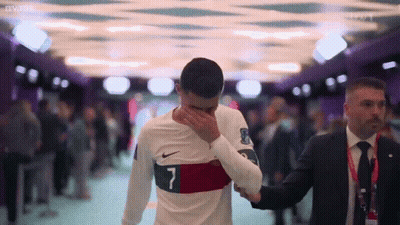 A Soccer Player With The Number 7 On His Shirt Is Covering His Face GIF