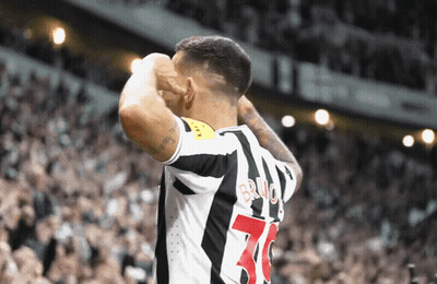 A Soccer Player With The Number 70 On His Jersey Stands In Front Of A Crowd GIF