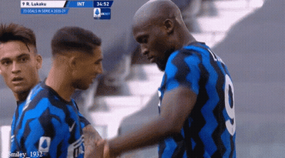 A Soccer Player With The Number 9 On His Back Shakes Hands With Another Player GIF