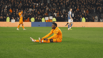 A Soccer Player With The Number 9 On His Jersey Is Being High Fived By Another Player GIF