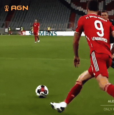 A Soccer Player With The Number 9 On His Jersey Is Kicking The Ball GIF