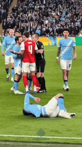 A Soccer Player With The Number 9 On His Jersey Is Laying On The Ground GIF