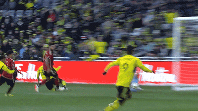 A Soccer Player With The Number 9 On His Jersey Kicks The Ball GIF
