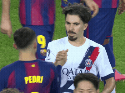 A Soccer Player With The Number 9 On His Jersey Shakes Hands With Another Player GIF