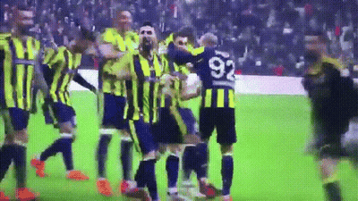 A Soccer Player With The Number 92 On His Jersey Is Surrounded By His Teammates GIF