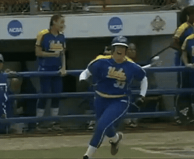 A Softball Player Wearing A Number 33 Jersey Is Running On The Field . GIF