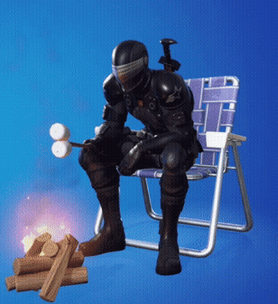 A Soldier Is Sitting In A Chair With A Marshmallow Stick GIF