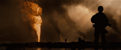 A Soldier Is Standing In Front Of A Large Fire And The Word Orbo Is On The Bottom Right GIF