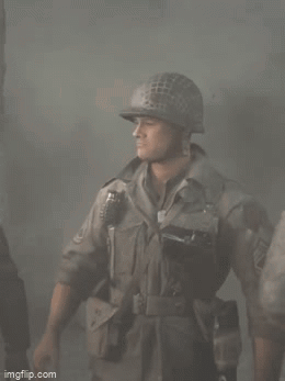A Soldier Is Wearing A Helmet And Holding A Grenade GIF