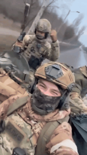 A Soldier Wearing A Helmet And A Mask Has The Letter O On His Chest GIF