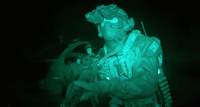 A Soldier Wearing A Helmet With A Patch That Says ' Uk ' On It GIF