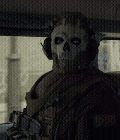 A Soldier Wearing A Skull Mask And Headphones GIF