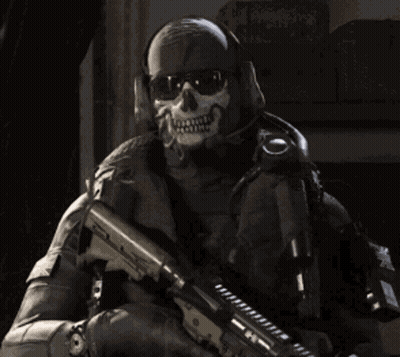 A Soldier Wearing A Skull Mask Holds A Gun GIF