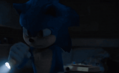 A Sonic The Hedgehog Holding A Flashlight In The Dark GIF