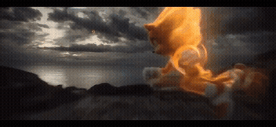 A Sonic The Hedgehog Is Flying Through The Air With A Cloudy Sky In The Background GIF