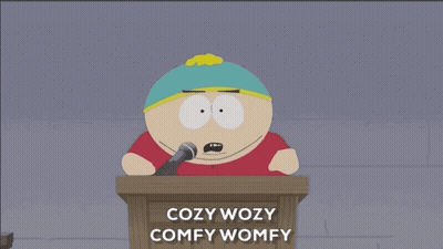 A South Park Character Giving A Speech With The Words Cozy Wozy Comfy Womy GIF