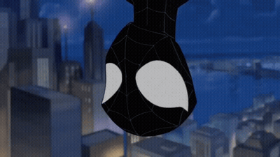 A Spider Man Hanging Upside Down In A City GIF