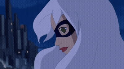 A Spider Man Hanging Upside Down In Front Of A City At Night GIF
