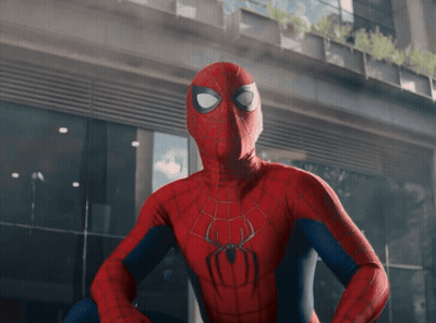 A Spider Man Standing In Front Of A Building GIF