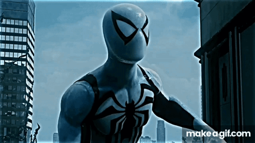 A Spider Man Standing In Front Of A City With Makeagif.com Written On The Bottom Right GIF