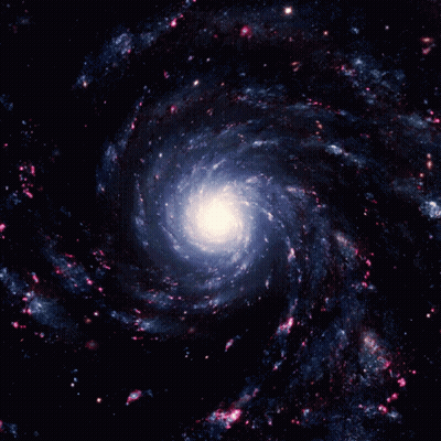 A Spiral Galaxy With A White Center Surrounded By Blue And Pink Stars GIF