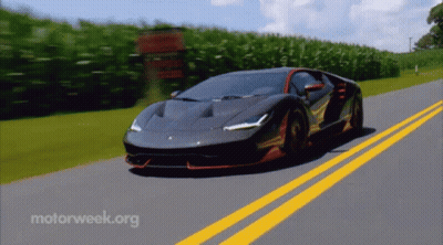 A Sports Car Is Driving Down A Road With Motorweek.org Written On The Bottom GIF