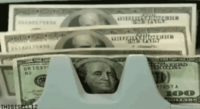 A Stack Of 100 Dollar Bills Being Counted GIF