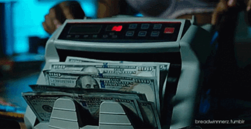 A Stack Of 100 Dollar Bills Being Counted By A Machine GIF