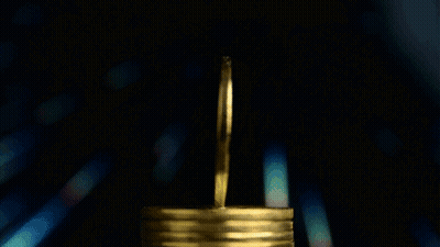A Stack Of Gold Coins With The Words Btc Moneytalks 199K In The Background GIF
