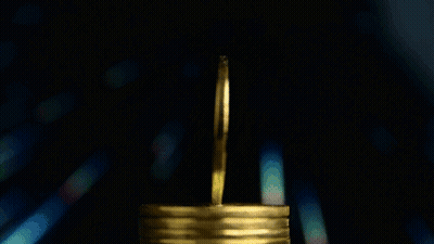 A Stack Of Gold Coins With The Words Btc Moneytalks On The Bottom GIF