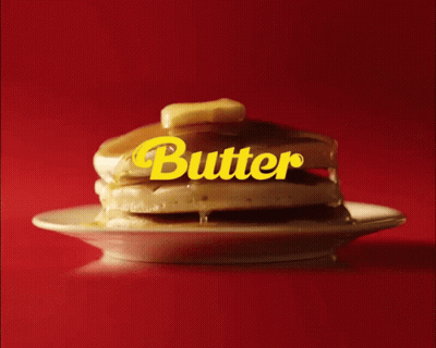 A Stack Of Pancakes On A Plate With The Word Butter Written On It GIF