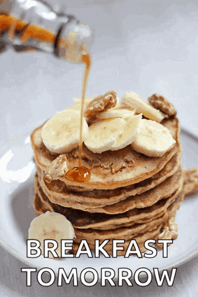 A Stack Of Pancakes With Bananas And Syrup With The Words Breakfast Tomorrow Below GIF