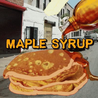 A Stack Of Pancakes With Maple Syrup Being Poured Over Them GIF