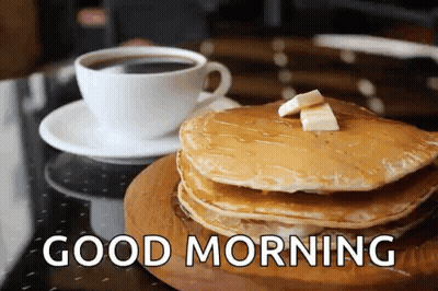 A Stack Of Pancakes With Syrup And Butter Next To A Cup Of Coffee With The Words Good Morning Below It GIF