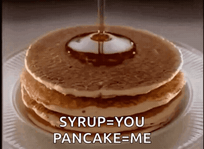 A Stack Of Pancakes With Syrup Being Poured On Top GIF