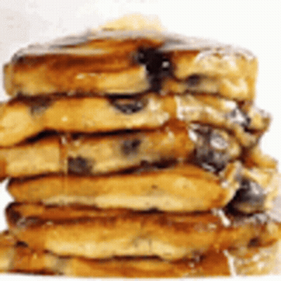 A Stack Of Pancakes With Syrup On Top Of Them On A White Background . GIF