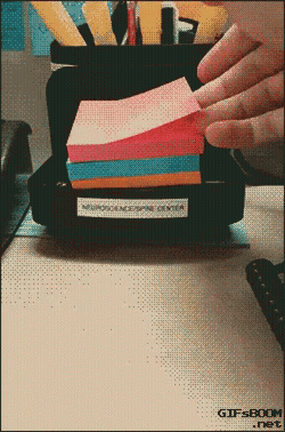 A Stack Of Sticky Notes Sits On A Desk With A Gifsboom.net Logo In The Corner GIF