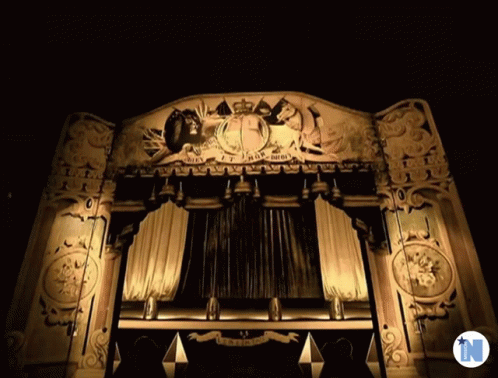 A Stage With A Sign That Says ' King ' On It GIF