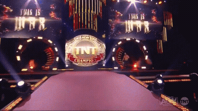 A Stage With A Tnt Champion Ring In The Center GIF