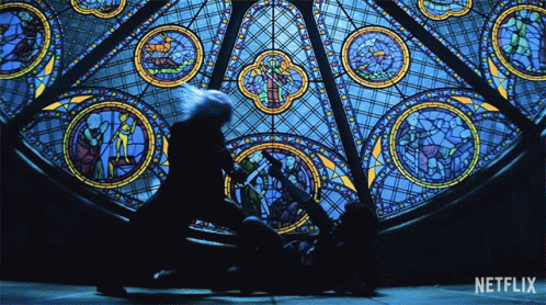 A Stained Glass Window With The Word Netflix On It GIF