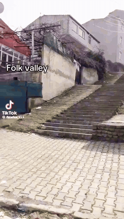 A Staircase Leading Up To A Building With The Words Folk Valley On The Bottom GIF