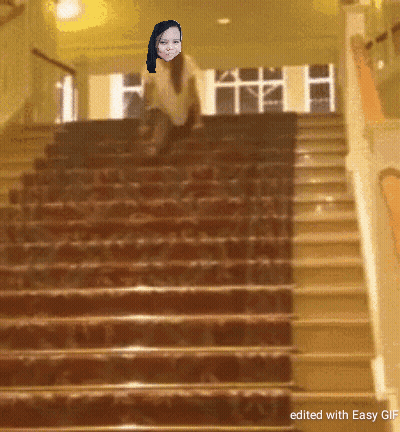 A Staircase With A Picture Of A Woman On It GIF