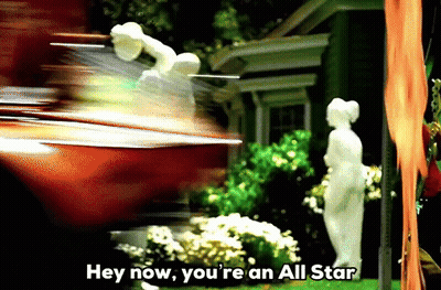 A Statue In Front Of A House With The Words Hey Now You 'Re An All Star Above It GIF