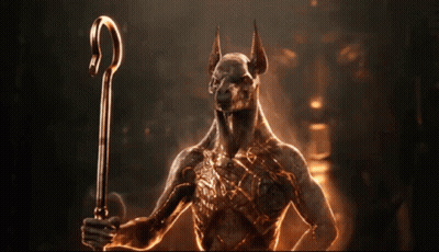 A Statue Of A Dog Holding A Cane GIF