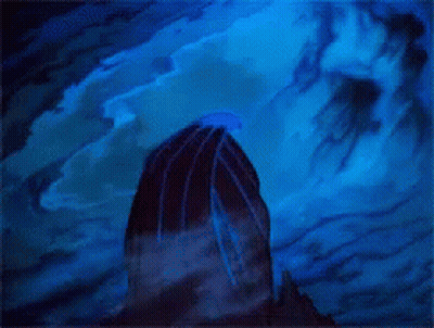 A Statue Of A Gargoyle Standing On Top Of A Rock GIF